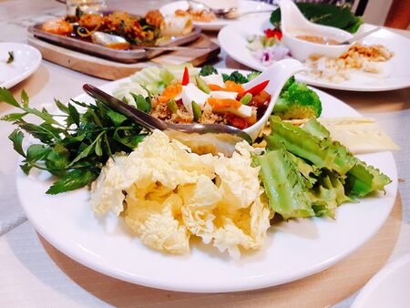 Chili paste, salted eggs and vegetables, Thai traditional spicy asia food in white plate.の写真素材