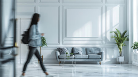 Modern Open Plan Living Room Electric Blue Sofa Empty White Wall Blur Womanの素材