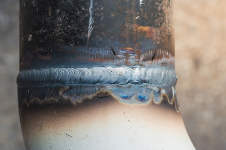The close up weld on a steel pipes for a new heat line. The welded joint on a steel pipes,high pressure line,high standards for oil line pipeの写真素材