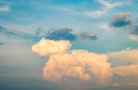 Beautiful sky painted by the sun leaving bright red shades.Surreal clouds on deep blue morning sky.sky in sunset and raincloud art beautiful in nature, space for add textの写真素材