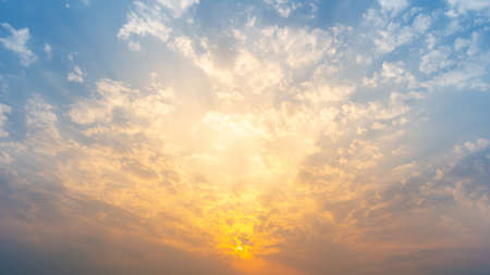 Beautiful Vivid sky painted by the sun leaving bright golden shades.の写真素材