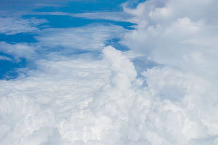 over the clouds,Blue sky with tiny clouds background Beautiful natural view from airplane window...