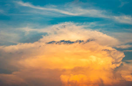Stormy sky with dramatic clouds from an approaching thunderstorm at sunset.Big red Storm Cloud in...