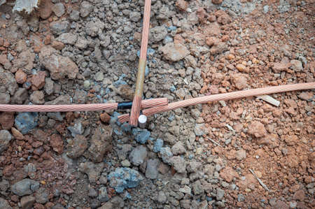 Welding copper ground wire on ground rod.Welding copper ground wire.Connect copper grounding lightning protection system. With the meltingの写真素材