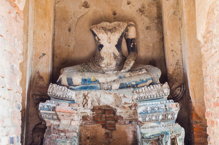 Broken ancient Buddha statue,Ancient buddha broken at wat chaiwattanaram ayuthaya thailandの写真素材