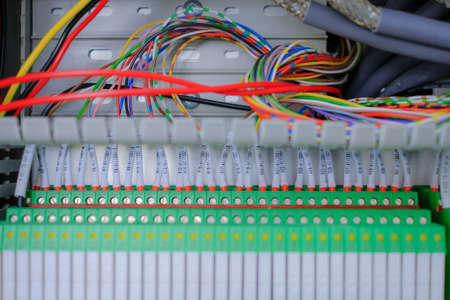 Wiring PLC Control panel with wires industrial factory.Wiring terminals in the electrical Cabinet....