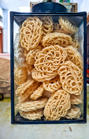 Kerupuk or Crackers, which are traditional Indonesian snacks, are placed in jars sold by stallsの写真素材