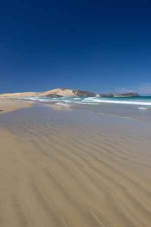 Te Werahi Beach and Cape Maria Van Diemen in Cape Reinga, Northland, New Zealand.の写真素材