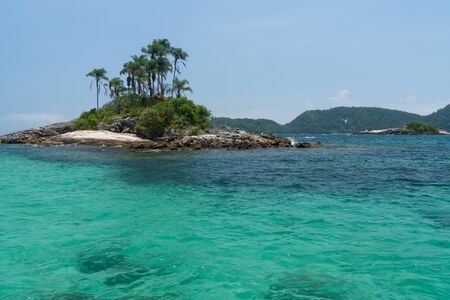 Tiny cliche tropical islands of Ilhas Paradisiacas off the coast of Ilha Grande in Angra dos Reis in the state of Rio de Janeiro. They have palm trees, white sand, rocks and turquoise tropical water.の写真素材