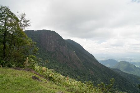 The granite mountain Pedra do Elefante - Elephant Rock, Teresopolis, state of Rio de Janeiro, Brazil. The forested peak has tall vertical rock walls in the mountains of Serra dos Orgaos National Park.の写真素材