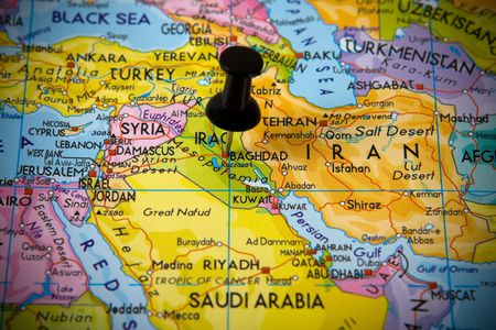 Small pin pointing on Baghdad (Iraq) in map of Near Eastの写真素材