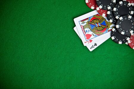 Black and red poker chips in the background.