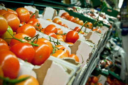 Picture of fresh tomatoes and other vegetables in supermarketの写真素材
