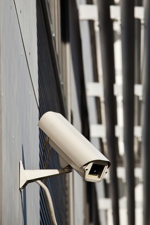 Security camera attached on buildingの写真素材