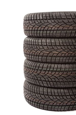 Stack of new black car tires in studio