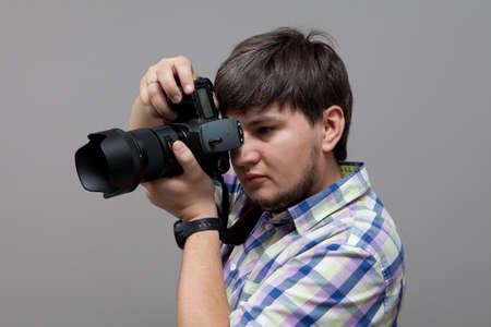 photographer with camera taking pictures