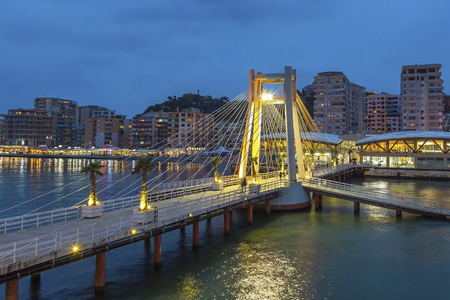 Beach and jetty in Durres, Albania by nightの写真素材