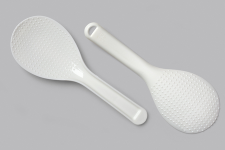 White spatula for slow cooker on a gray  backgroundの写真素材