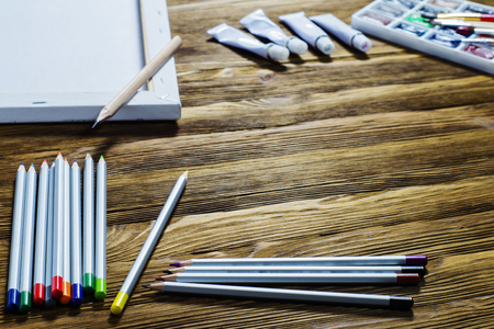 Workplace of designer, artist, painter. Accessories to drawing: canvas, paints, brushes, pencils.の写真素材