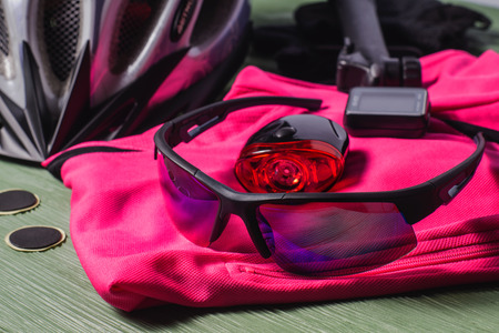 Items replacements and tools for a safe cycling: Helmet, gloves, glasses, pump, patches. Sport equipment, sports uniform.の写真素材