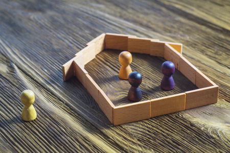 The concept of a mortgage, buying a home. The man in the house, and people without a home.の写真素材