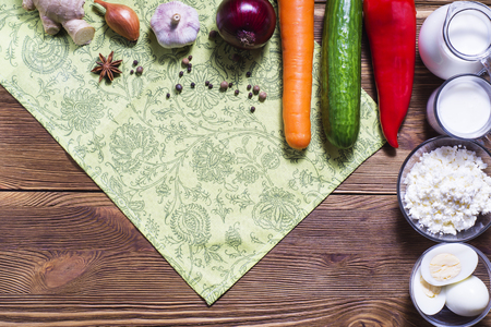 Frame of fresh vegetables and dairy products on wooden background.の写真素材
