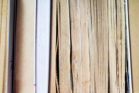 A stack of books in hard and soft cover.の写真素材
