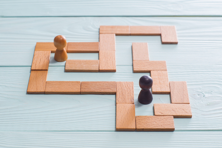 Two people inside the Maze. The concept of a business strategy, analytics, search for solutions, the search output.の写真素材