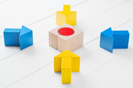 Four wooden arrows converge towards the center target. Arrows pointing to the object. The concept of...