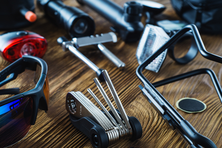 Tools and accessories set for cycling. Accessories for bicycles trips: universal screwdriver tool ...
