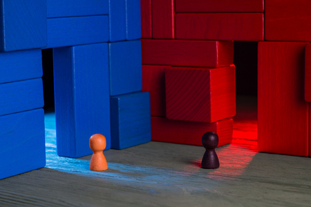 Choice concept. Two abstract business persons and two doors, blue and red, doubtful. The man hesitates before choosing. Business Mans standing in front of two doors, unable to make the right decision.の写真素材