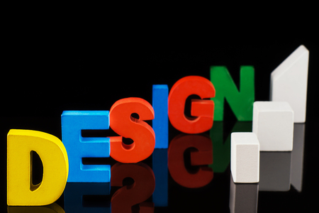 The concept of design word on colorful wooden letters. Design word letters.Letters collected in the word Designの写真素材