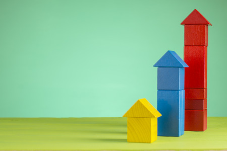 The concept of success. Business graph. Growth progress concept with arrows. Growing graph of  wooden blocks.の写真素材