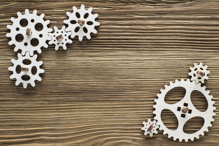 Gear wheels on wooden background. The concept of creative, logical thinking. Logic background. の写真素材