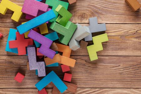 Abstract background with different colorful shapes wooden blocks. Geometric shapes in different colors. Concept of creative, logical thinking.の写真素材