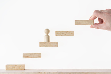 Concept of business learning success. Man climbs the stairs.の写真素材