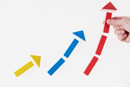 Growth progress concept with arrows. Growing graph of wooden blocks.の写真素材
