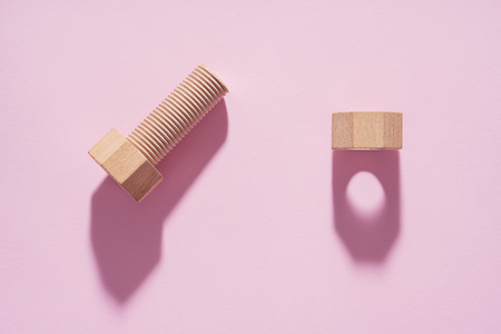 Hex nut and bolt on pink background.の写真素材