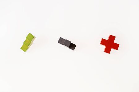 Different colorful shapes wooden blocks on white wooden background, flat lay, copy space.の写真素材