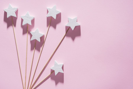 Beautiful background with fireworks of wooden white stars on a pink, pop art.の写真素材