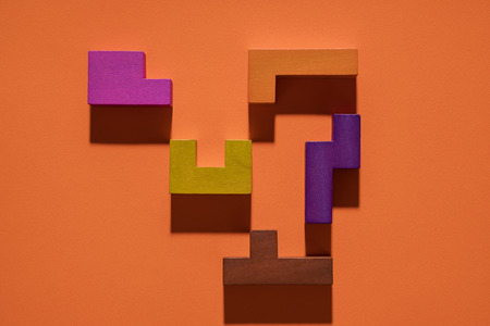 Abstract geometric background, colorful logic game. Isometric game blocks on orange background. Pop art style design. Logical concept. の写真素材