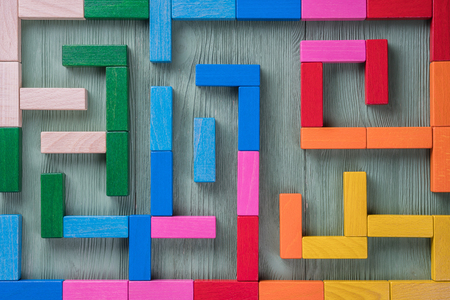 Colorful maze on brown background.