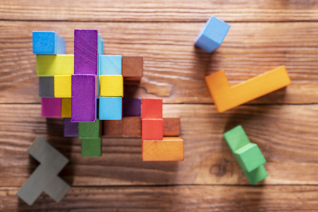 The concept of logical thinking. Geometric shapes on a wooden background.の写真素材