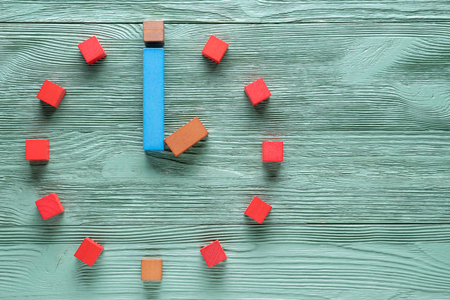 Colorful clock from wooden cubes, two hour.の写真素材
