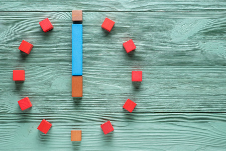 Colorful clock from wooden cubes, six hour.の写真素材