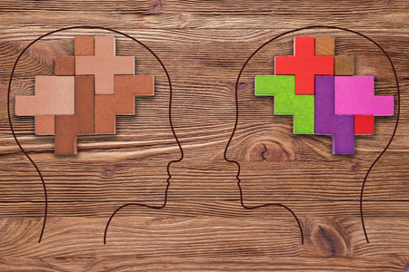 Stereotypical thinking and creative thinking. Heads of two people with colourful shapes of abstract brain for concept of idea and teamwork. Two people with different thinking.の写真素材