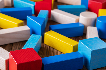 Abstract Background. Background with different colorful shapes wooden blocks . Geometric shapes in different colors. Concept of creative, logical thinking.の写真素材