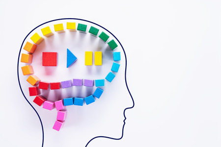 Human head with abstract colorful human brain, creative concept. The work of the brain, stop, start, pause. Disable emotions. Top view, flat lay.の写真素材