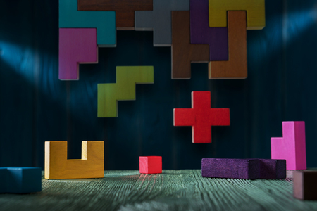 The concept of logical thinking. Geometric shapes on a wooden background.の写真素材