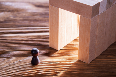 Abstract man into the wooden corridor with copy space. Concept of success. Abstract man in a wooden tunnel.の写真素材